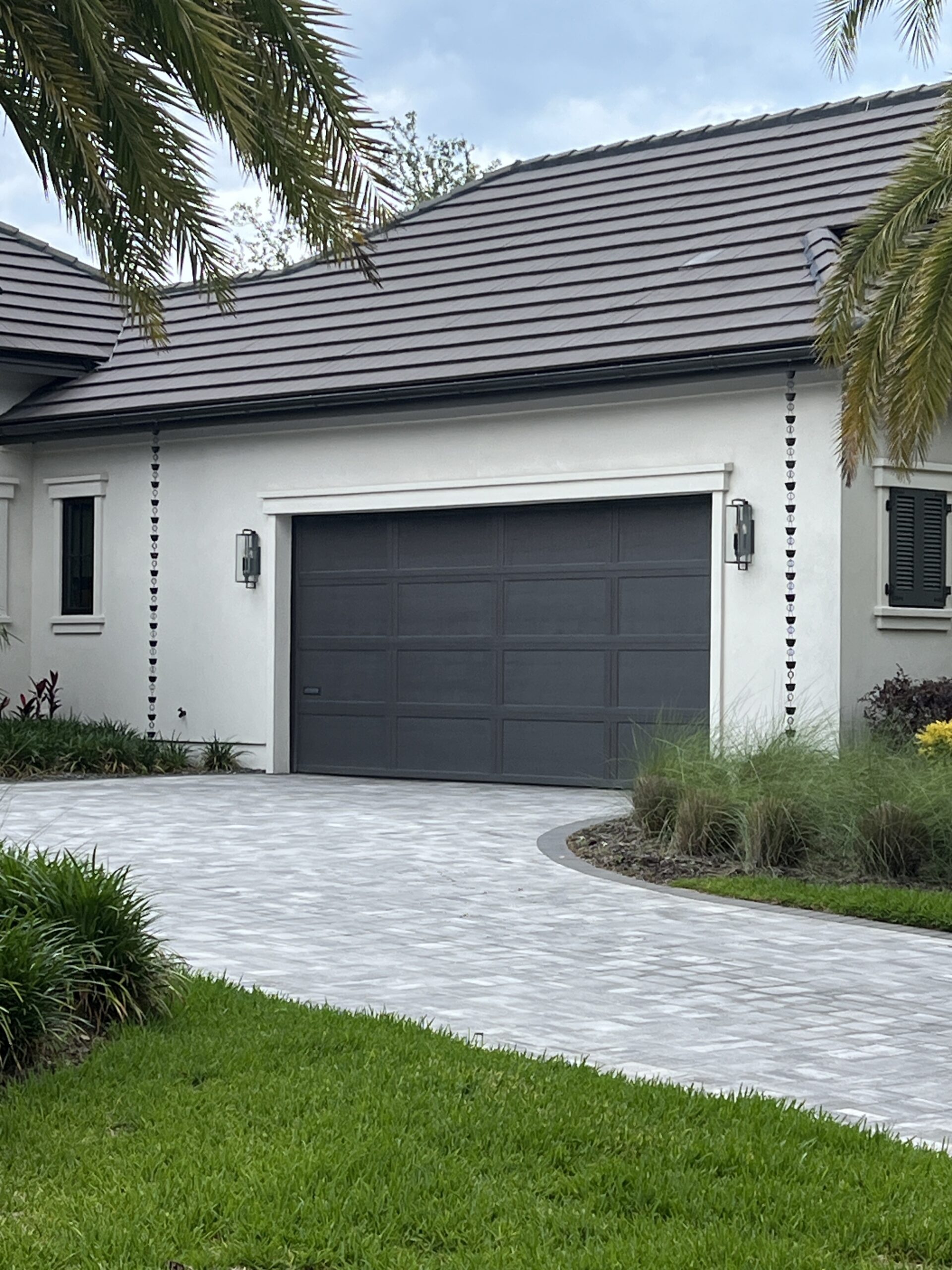 Modern white house with dark gray garage door